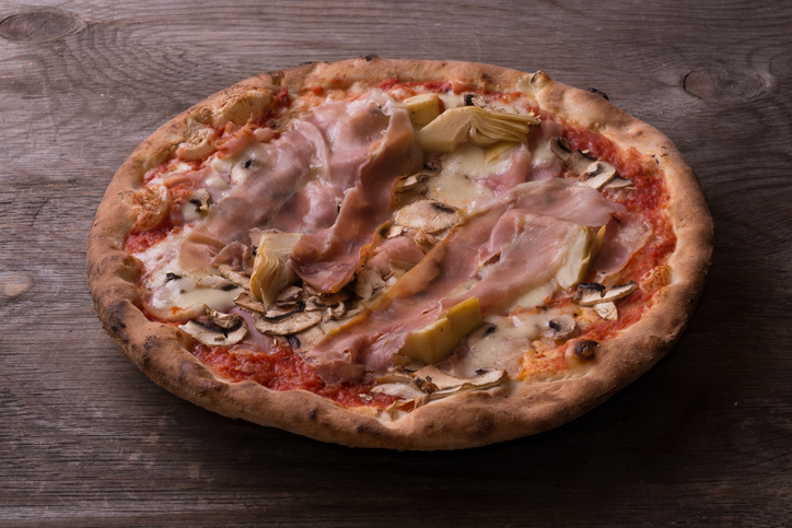 Pizza with ham, mushrooms and artichokes Langosch klassisch a la Mama